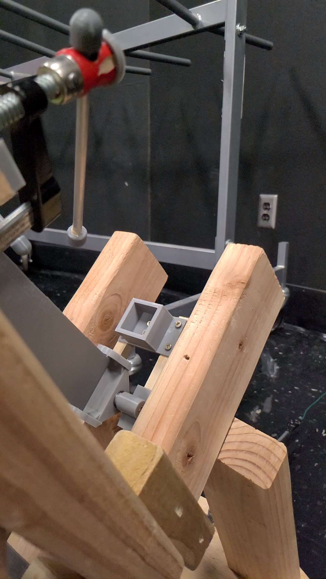 Close-up of a wooden mechanical arm built for a device event